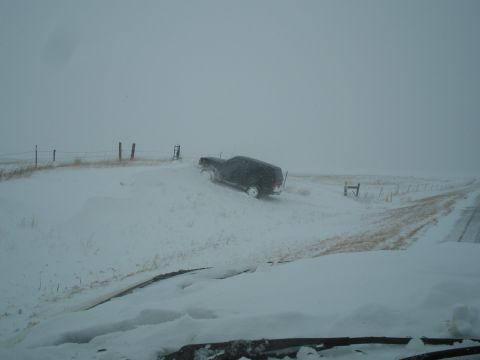 1990 Ford Bronco - SUV stuck in snowdrift on a winter day.