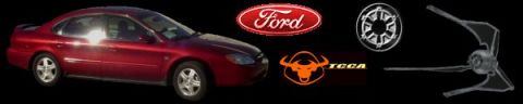 2000 Ford Taurus - Red sedan with Ford logo and other graphics, possibly a 2000 Ford Taurus.