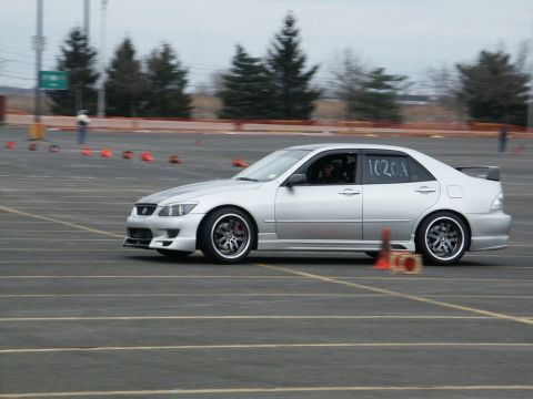 2001 Mercury Grand Marquis - A silver sedan navigates a course marked by cones, displaying the number 1020A on its side.