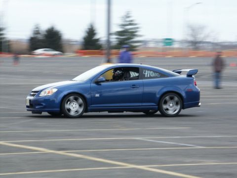 2001 Mercury Grand Marquis - A blue coupe with a prominent spoiler and racing number 470tc is seen on a track.