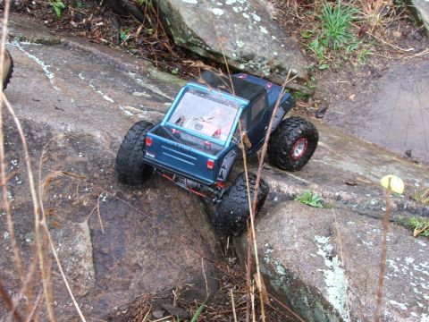 1996 Ford Bronco - An RC truck navigates a rocky terrain, its off-road capabilities.