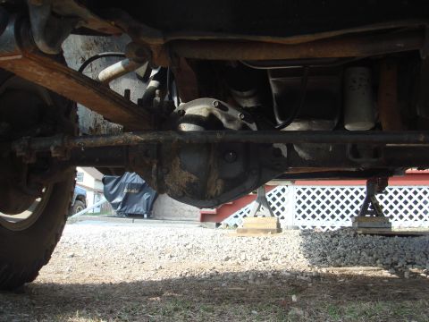 1978 Chevrolet C/K Pickup - Underside view showing the rear differential and suspension system of a vehicle.