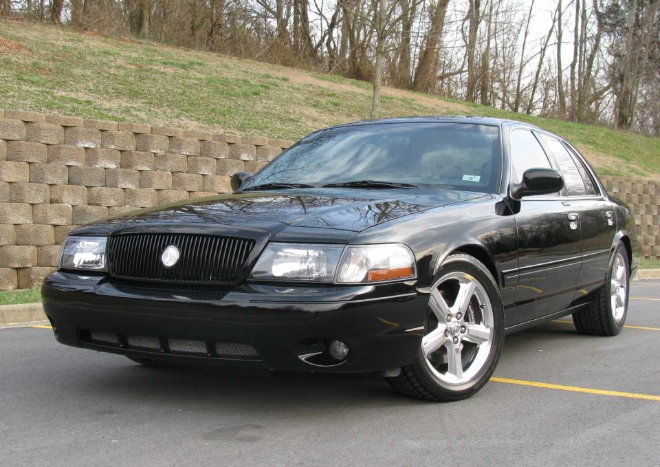 Black Mercury Marauder sedan, 3/4 front view in a parking lot