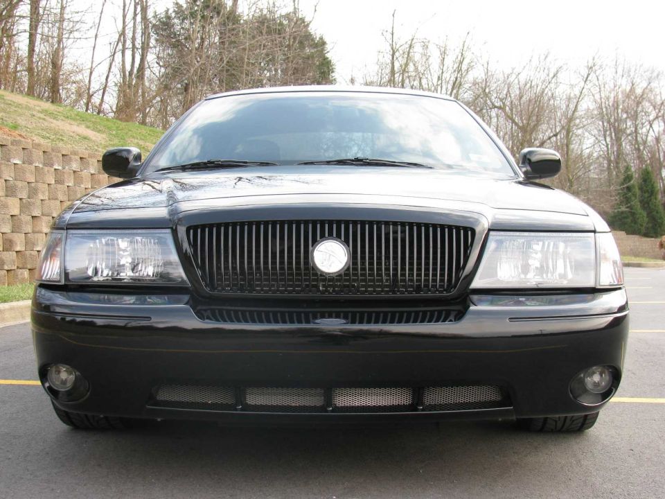 Front view of black Mercury Marauder sedan with blacked-out grille and fog lamps