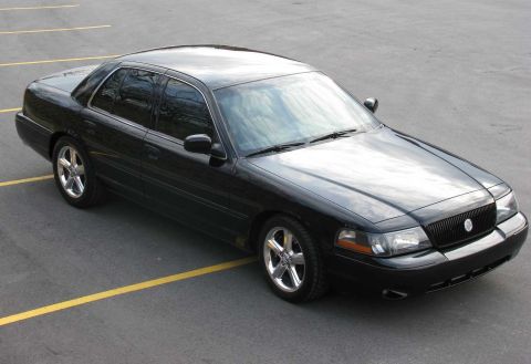 2003 Mercury Marauder - A black 2003 Mercury Marauder is parked in a lot, viewed from a 3/4 front angle.