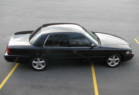 2003 Mercury Marauder - A black 2003 Mercury Marauder is shown from the side in a parking lot.