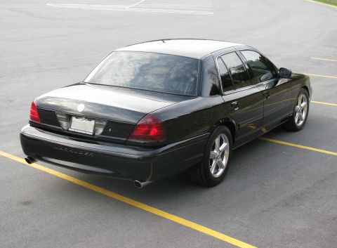 2003 Mercury Marauder - The rear of a black 2003 Mercury Marauder sedan is visible from a 3/4 angle.