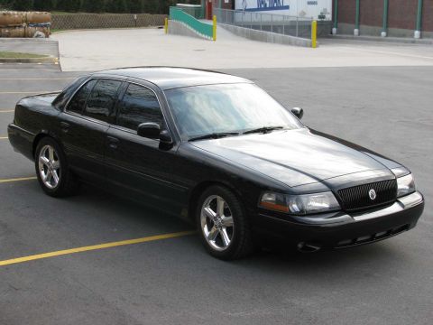 2003 Mercury Marauder - A black 2003 Mercury Marauder is parked in an outdoor lot, viewed from a three-quarter front angle.