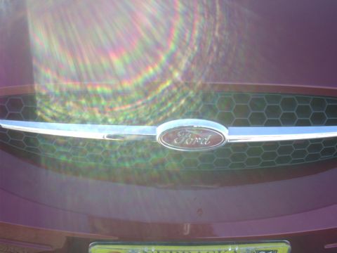 2000 Ford Taurus - Close-up of the front grille and Ford emblem on a 2000 Taurus.
