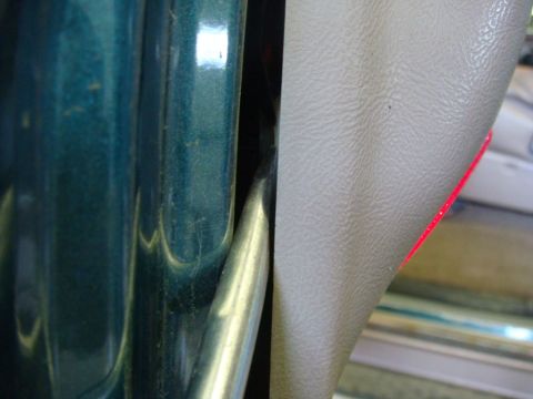1996 Ford Bronco - Close-up of the interior door panel and frame on a 1996 Ford Bronco.