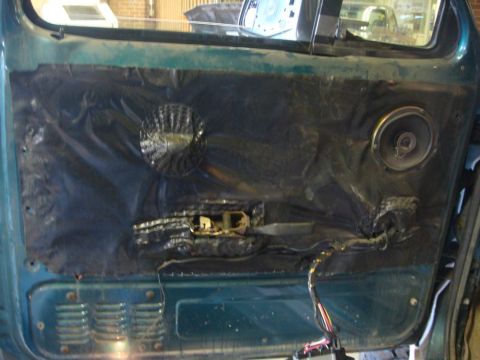 1996 Ford Bronco - The interior door panel shows speakers and wiring, suggesting a repair or modification is in progress.