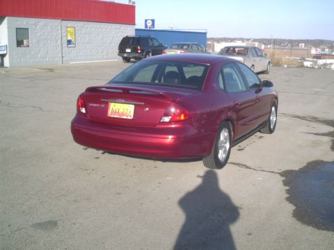 2000 Ford Taurus - This 2000 Ford Taurus is seen from the rear in a parking lot, with a yellow license plate visible.