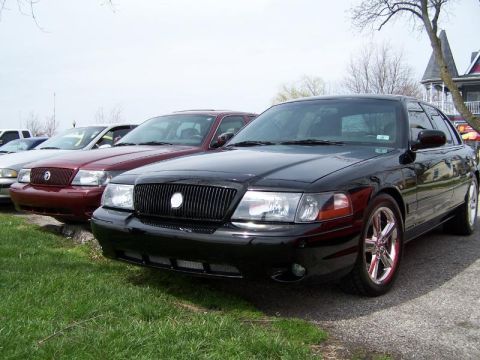 2003 Mercury Marauder - A black 2003 Mercury Marauder is parked in front of a maroon sedan.