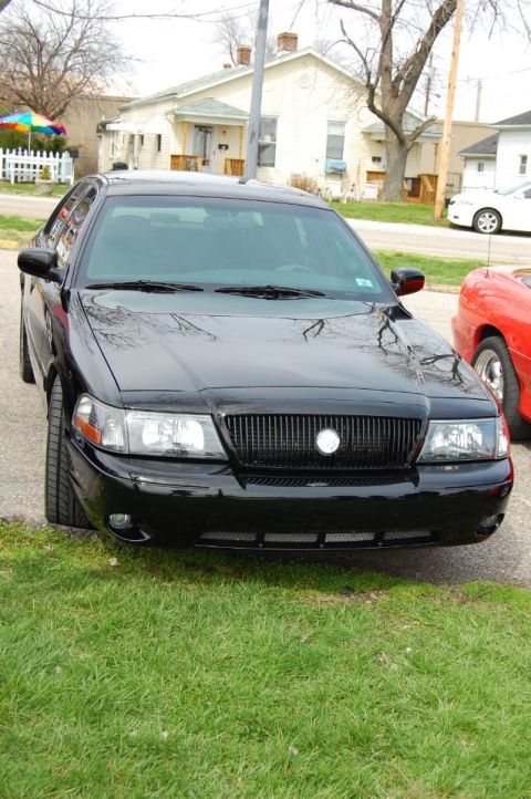 2003 Mercury Marauder - Front view of a black 2003 Mercury Marauder parked on grass.