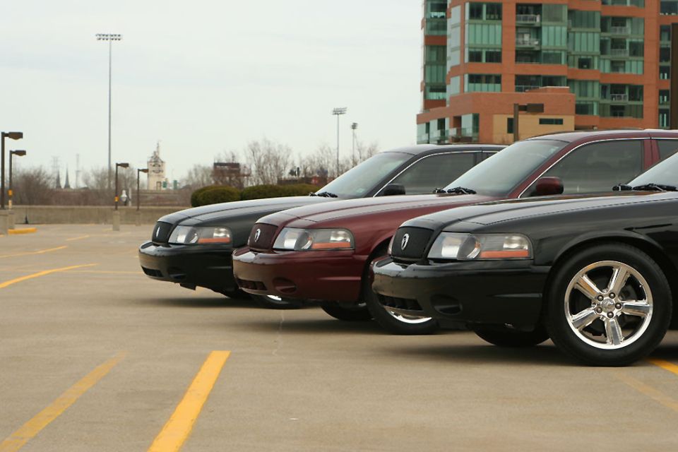 Three 2003 Mercury Marauders in a parking lot, front 3/4 view