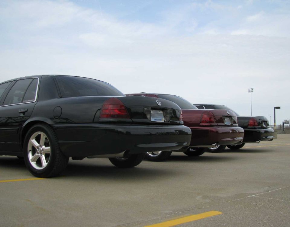 Three 2003 Mercury Marauders parked in a row, rear view