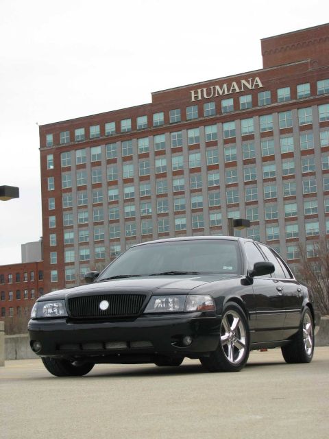 2003 Mercury Marauder - Black 2003 Mercury Marauder parked in front of a large brick building with 'HUMANA' signage.