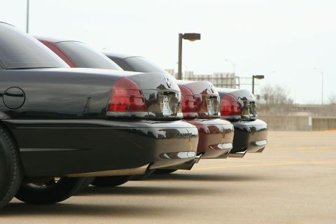 2003 Mercury Marauder - A line of sedans, including a black one in the foreground, are parked in an outdoor lot.