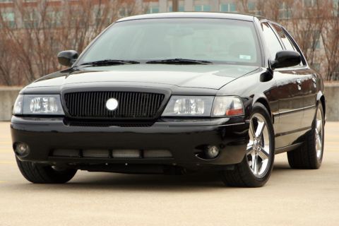 2003 Mercury Marauder - This black 2003 Mercury Marauder is shown from the front, its distinctive grille and headlights.