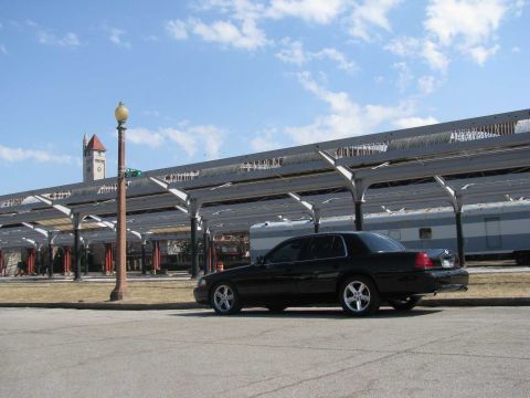 2003 Mercury Marauder - A black 2003 Mercury Marauder is parked near a train station with a train visible in the background.