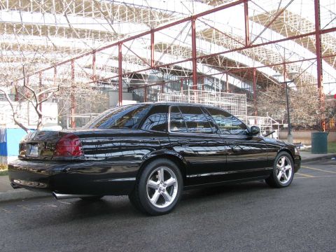 2003 Mercury Marauder - This black 2003 Mercury Marauder is captured from a rear three-quarter angle, its distinctive body style.
