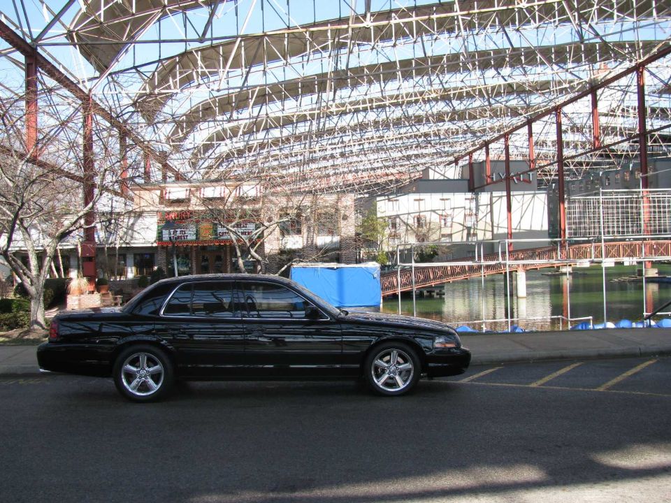 2003 Mercury Marauder parked by water under a large metal roof structure