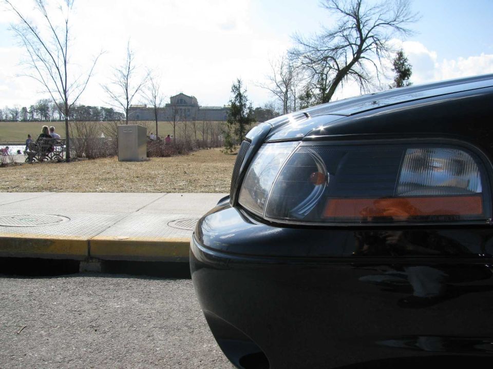 Front corner of black 2003 Mercury Marauder showing headlight and part of fender