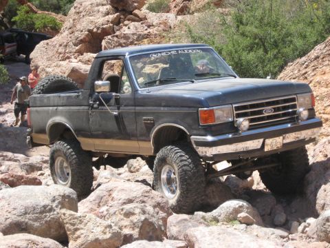 1991 Ford Bronco - This Ford Bronco navigates a rocky trail, its off-road capabilities.