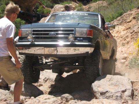 1991 Ford Bronco - This 1991 Ford Bronco navigates a challenging rocky trail, displaying its "4x4" capability.