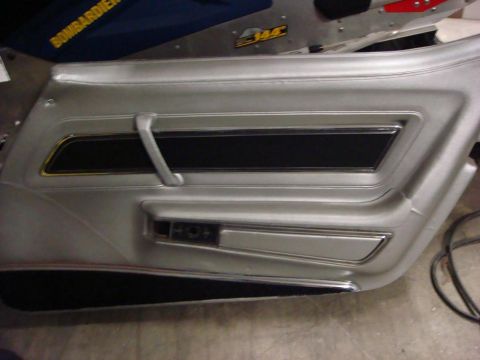 1975 Chevrolet Corvette - Door panel after restoration. Dyed the lower carpeting black, removed the wood grain insert and painted the insert black, re-dyed the panel…