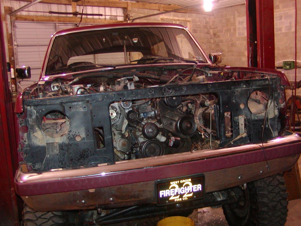 1991 Ford Bronco front end with hood removed, showing engine and front grille area