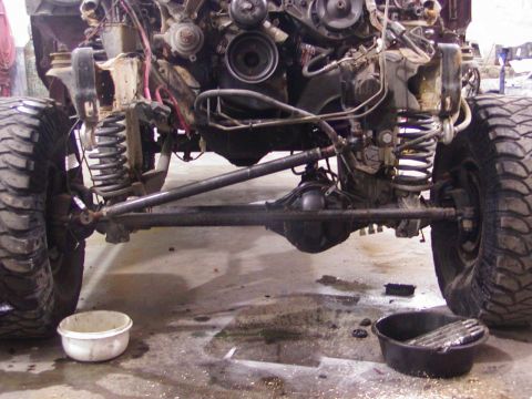 1991 Ford Bronco - The front suspension and engine of a 1991 Ford Bronco are visible in this disassembled view.