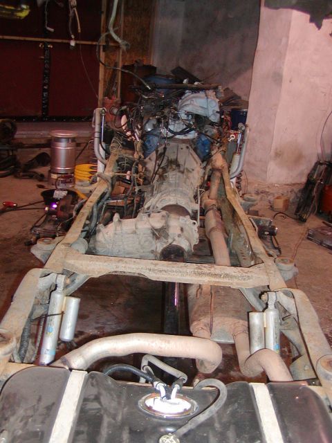 1991 Ford Bronco - The engine and transmission have been removed from this vehicle's chassis, revealing its internal components.