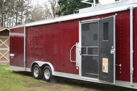 1993 Ford C-350 (Centurion Conversions) - Exterior view of a maroon enclosed cargo trailer parked on grass.