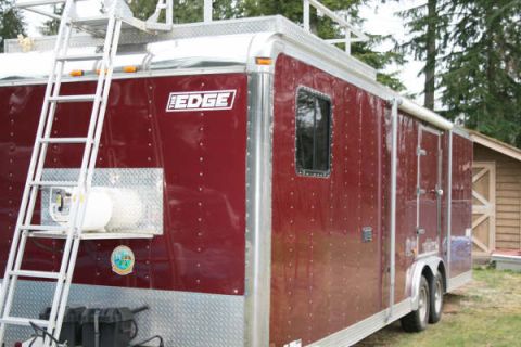 1993 Ford C-350 (Centurion Conversions) - This is a side view of a red enclosed cargo trailer with a ladder and a prominent 'EDGE' logo on its exterior.