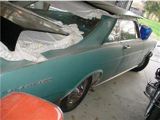 1972 Ford Ranchero - This 1967 Ford Galaxie 500 is covered in a garage, showing its side profile.