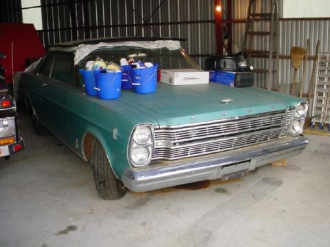 1972 Ford Ranchero - This 1966 Ford Galaxie 500 coupe is parked inside a garage with buckets on its hood.