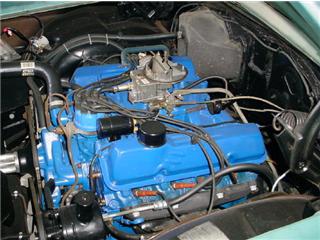 1972 Ford Ranchero - Close-up view of a blue V8 engine, showing the carburetor, wiring, and various engine components.