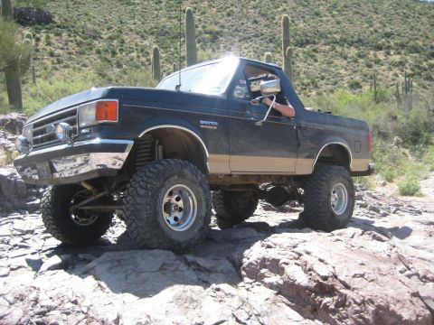 1991 Ford Bronco - This lifted 1991 Ford Bronco navigates a rocky desert trail.