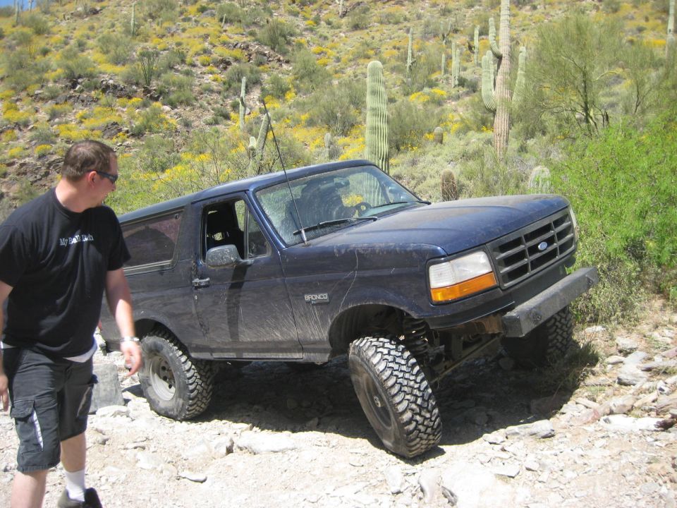 Dark blue 1992 Ford Bronco on rocky desert trail