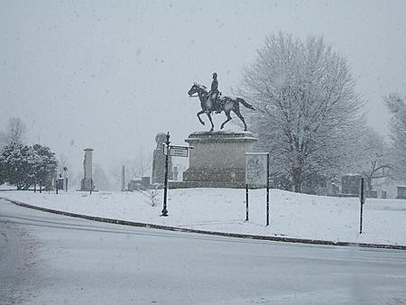 1982 Toyota 4Runner - A statue of a person on horseback stands in a snow-covered park during a winter storm.
