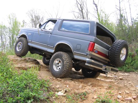 1989 Ford Bronco - This 1989 Ford Bronco is tackling a challenging rocky off-road course.