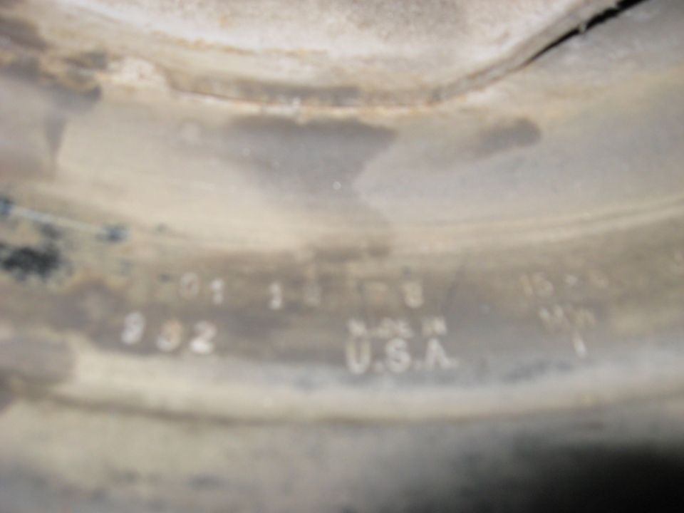 Close-up of a part with numbers and 'MADE IN U.S.A.' stamped on it
