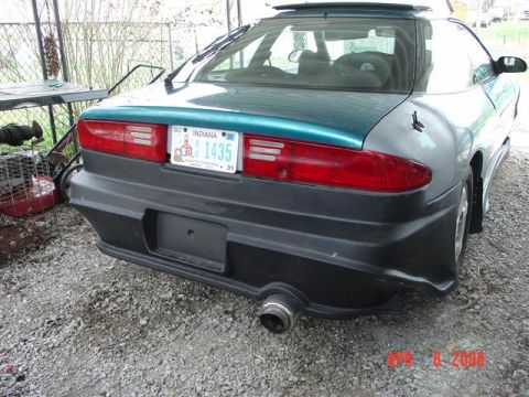 1993 Ford Probe - Rear view of a 1993 Ford Probe with a custom body kit and teal and gray paint.