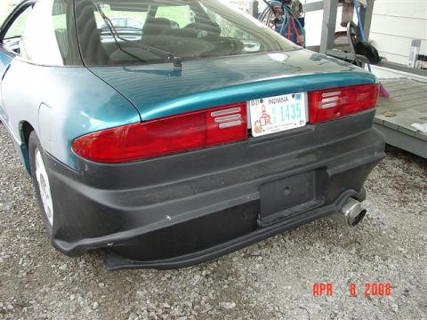 1993 Ford Probe - Rear view of a teal and silver car, an aftermarket bumper and exhaust. The Indiana license plate is visible.