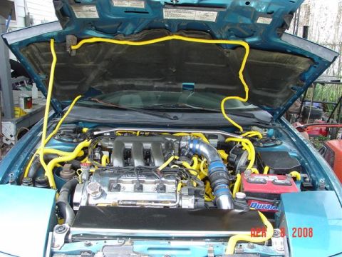 1993 Ford Probe - The engine bay of a car is shown with many yellow hoses and a V6 engine. A date stamp indicates the photo was taken in 2008.