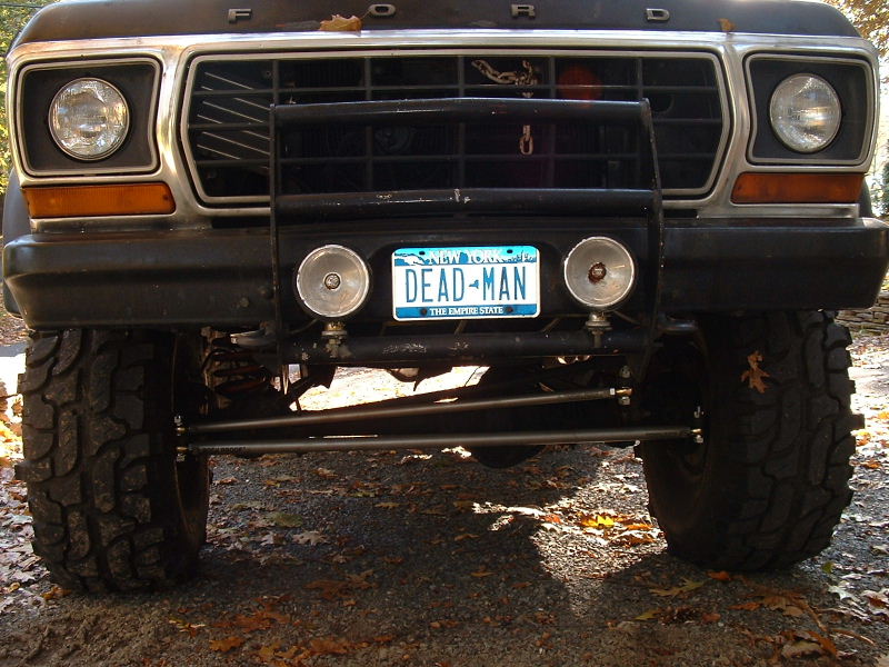 Front of a lifted 1970s Ford 4x4 with brush guard and DEAD MAN New York plate