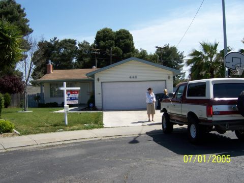 1991 Ford Bronco - 1991 Ford Bronco parked in front of a suburban house on a sunny day.