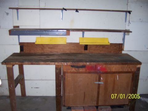 1991 Ford Bronco - A wooden workbench with shelves above is pictured with a date stamp of 07/01/2005.