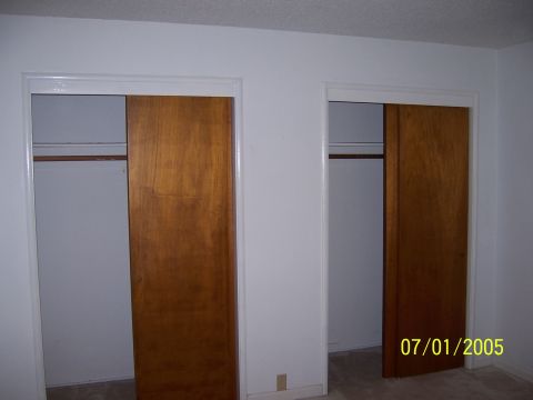 1991 Ford Bronco - Interior view of a room with two wooden closet doors and a date stamp of 07/01/2005.